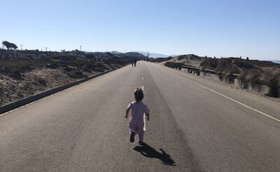 Child running at highway